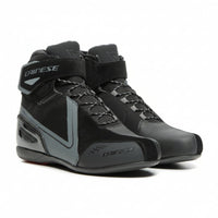 A pair of Dainese Women's Energy ENERGYCA D-WP Shoes in black color, featuring a waterproof membrane, gear shifter guard, multi-grip outsole, and reflective inserts.