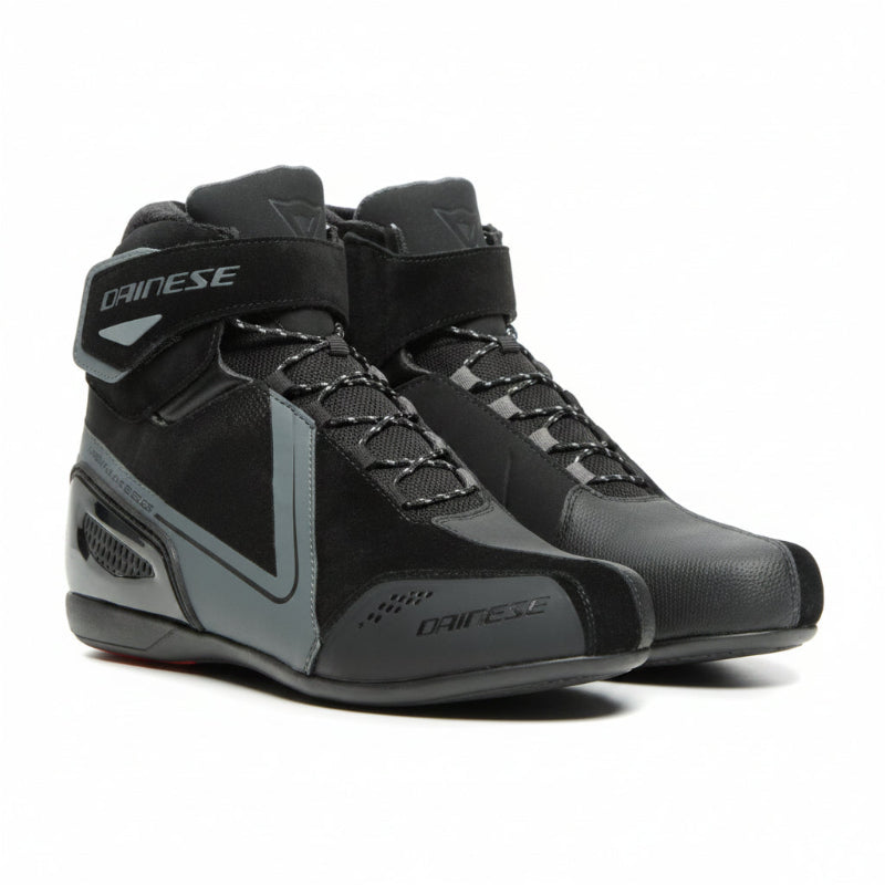 A pair of Dainese Women's Energy ENERGYCA D-WP Shoes in black color, featuring a waterproof membrane, gear shifter guard, multi-grip outsole, and reflective inserts.