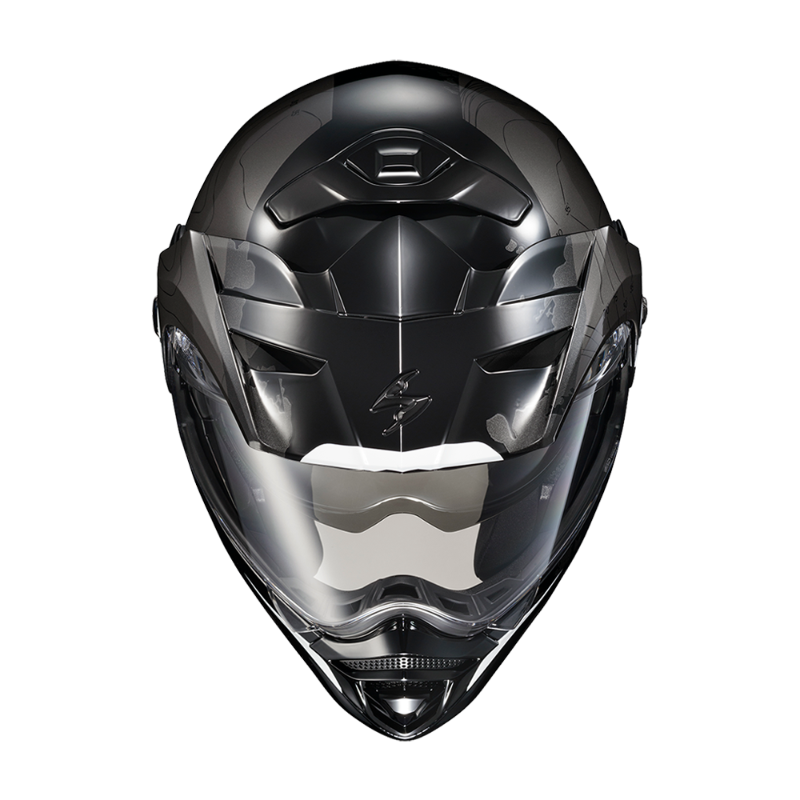 Front view of the Scorpion EXO-AT960 Topographic Modular Adventure Motorcycle Helmet in Black/White. The helmet features a matte black and metallic grey finish with subtle topographic map graphics and white accent details. A clear EverClear® face shield provides wide visibility, while the aerodynamic adventure peak visor, integrated ventilation system, and aggressive chin vent enhance airflow and performance. Designed for adventure touring and dual-sport riding, the EXO-AT960 combines rugged styling, modula