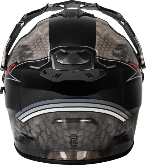 Rear view of the Fly Racing Trekker Kryptek Dual Sport Motorcycle Helmet in Black/Grey featuring a Kryptek camouflage graphic, rear exhaust vents, adjustable peak visor, and ECE 22.06/DOT-certified adventure touring design for riders in Canada.