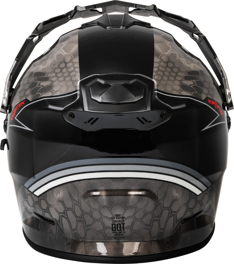 Rear view of the Fly Racing Trekker Kryptek Dual Sport Motorcycle Helmet in Black/Grey featuring a Kryptek camouflage graphic, rear exhaust vents, adjustable peak visor, and ECE 22.06/DOT-certified adventure touring design for riders in Canada.