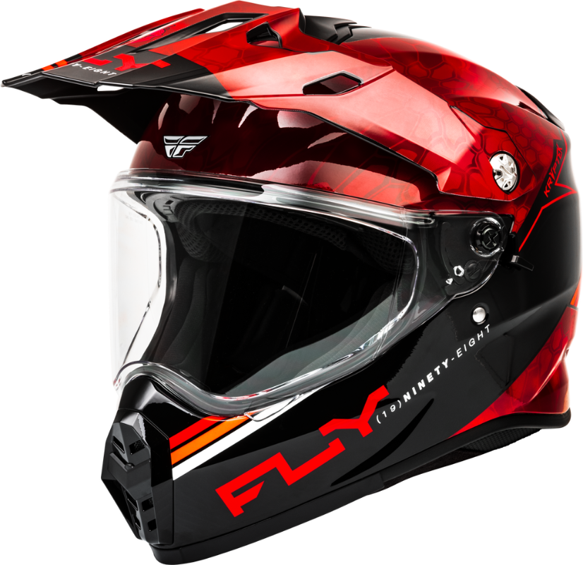 Fly Racing Trekker Kryptek Dual Sport Motorcycle Helmet in Red and Black with integrated clear face shield, adjustable peak visor, and ECE 22.06/DOT-certified adventure touring design for dual-sport and ADV riders in Canada.