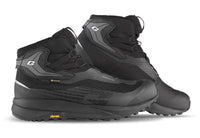 A pair of black and dark gray high-top outdoor boots with Vibram soles, shown on a clean white background.