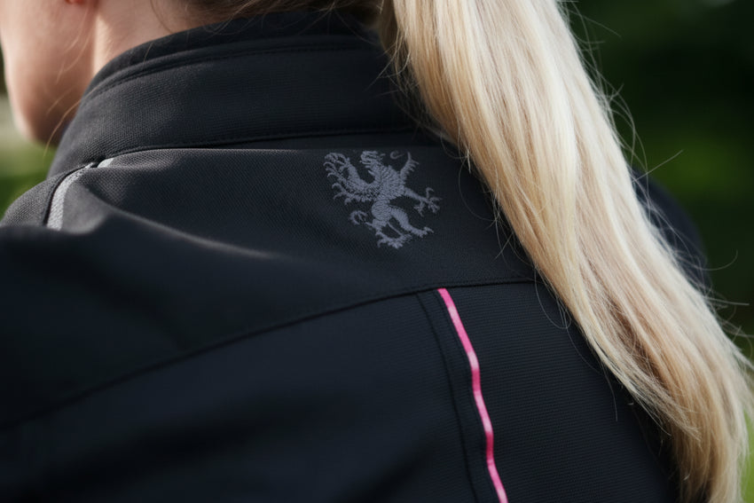 closeup of a woman wearing Gryphon Women's AQUA AIR Mesh Jacket  on a black background