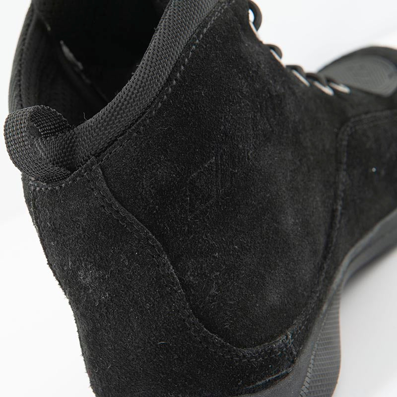 Close-up rear view of the Joe Rocket Blaster Waterproof Motorcycle Shoe showcasing the premium black suede upper, padded ankle collar, reinforced heel support, and rear pull loop for easy entry. Designed for everyday motorcycle riding with a comfortable sneaker-inspired fit, durable construction, and added ankle protection.