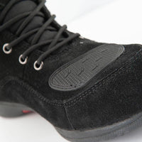 Close-up of the Joe Rocket Blaster Waterproof Motorcycle Shoe highlighting the reinforced rubber shift pad on the toe and premium black suede upper. Designed to reduce wear from gear shifting while providing added durability, grip, and protection for commuting, urban riding, and everyday motorcycle use.