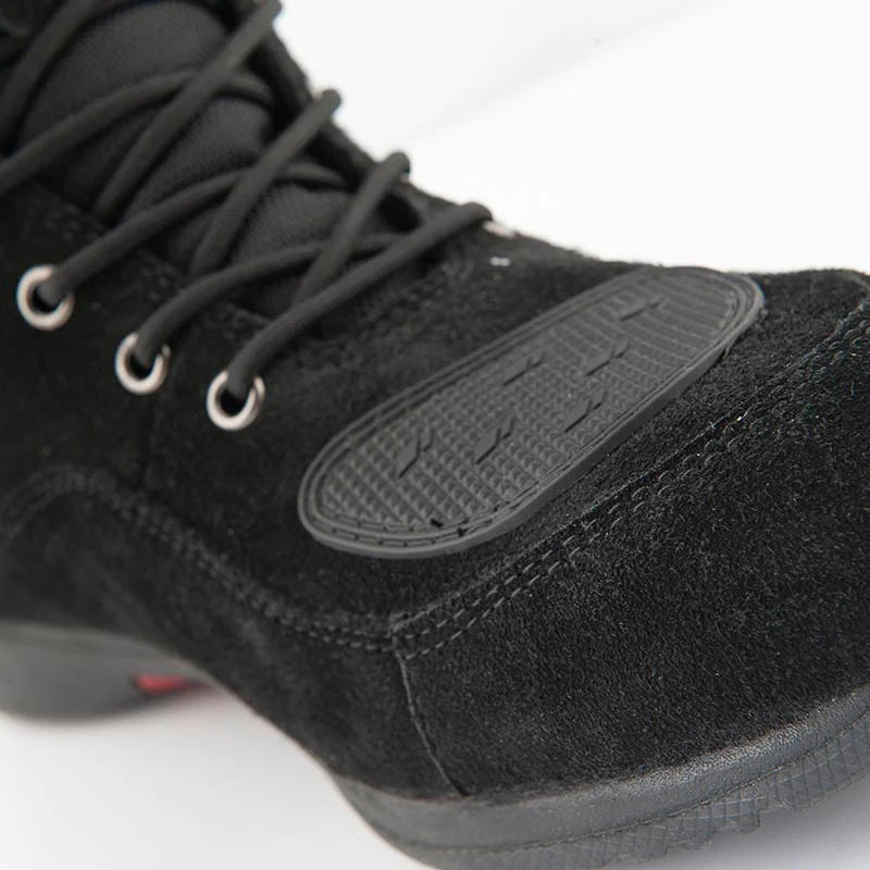 Close-up of the Joe Rocket Blaster Waterproof Motorcycle Shoe highlighting the reinforced rubber shift pad on the toe and premium black suede upper. Designed to reduce wear from gear shifting while providing added durability, grip, and protection for commuting, urban riding, and everyday motorcycle use.