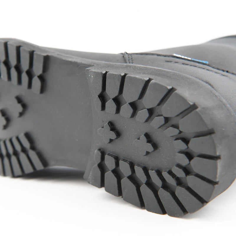 Close-up of the Joe Rocket Iron Age Waterproof Motorcycle Cruiser Boot outsole featuring a deep-lug rubber tread pattern designed for enhanced grip, stability, and durability. The rugged sole provides dependable traction on wet roads, gravel, and uneven surfaces for cruiser, touring, and everyday motorcycle riding.