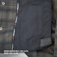 Close-up of the interior hem of the Joe Rocket Richmond™ Armored Motorcycle Shirt showing the hidden microfiber lens cloth. The soft microfiber panel is discreetly sewn into the inside hem for conveniently cleaning helmet visors, goggles, sunglasses, or glasses while on the road. The image also highlights the breathable mesh lining and premium interior construction.