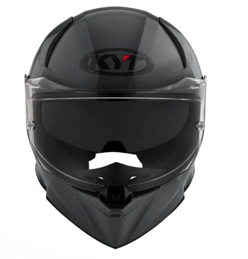 Grey motorcycle helmet with clear visor on a white background