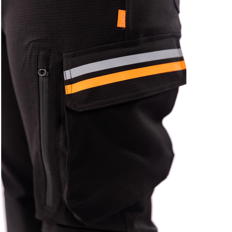 Close-up of the MotoGirl Vanessa Women's Motorcycle Pants cargo pocket featuring a large flap pocket with reflective silver and orange trim for increased visibility. A waterproof vertical zip pocket provides secure storage, while the D3O® tag indicates compatibility with premium impact protection for adventure and touring motorcycle riders.