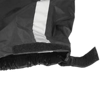 Close-up of the Nelson-Rigg STORMRIDER motorcycle rain pants cuff featuring an adjustable hook-and-loop (Velcro) ankle closure, elastic cuff, and reflective strip for a secure fit over motorcycle boots, enhanced weather protection, and improved low-light visibility.