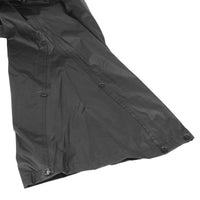 Close-up of the Nelson-Rigg STORMRIDER motorcycle rain pants featuring full-length lower leg expansion gussets with snap closures, allowing the waterproof over-pants to fit easily over motorcycle boots while providing a secure, weather-resistant seal.