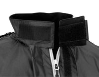 Close-up of the Nelson-Rigg SSJ SOLO STORM Motorcycle Rain Jacket collar showing the adjustable hook-and-loop (Velcro®) storm collar closure. The waterproof rain jacket features a high collar for wind and rain protection, a full-length front zipper with storm flap, and durable black polyester construction designed to seal out the elements during motorcycle riding.