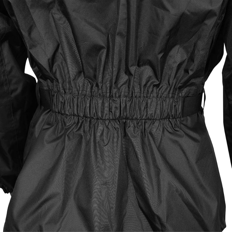 Close-up rear view of the Nelson-Rigg SSJ SOLO STORM Motorcycle Rain Jacket featuring an elasticized waist with adjustable side straps for a secure, comfortable fit over motorcycle riding gear. The waterproof black rain jacket is designed to reduce wind flap while improving comfort and weather protection during wet-weather rides.