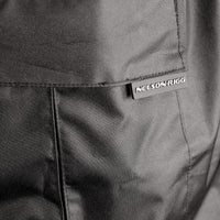 Close-up detail of the Nelson-Rigg SSJ SOLO STORM Motorcycle Rain Jacket showing the durable cargo pocket with flap closure and Nelson-Rigg logo tab. Constructed from waterproof polyester Oxford fabric with reinforced stitching, the pocket provides secure, weather-resistant storage for essential riding items.