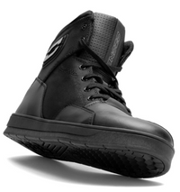 OZONE Spin black motorcycle boot shown from a low front-side angle, featuring a high-top design, lace-up closure, reinforced toe and heel panels, padded tongue and textured rubber riding sole.