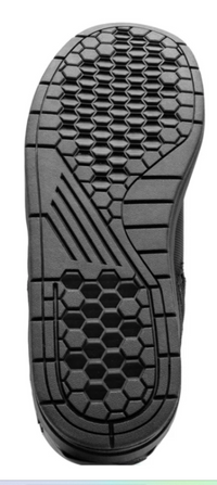 Bottom view of the OZONE Spin black motorcycle boot showing the textured rubber outsole with hexagonal tread pattern designed to provide grip and stability on and off the motorcycle.