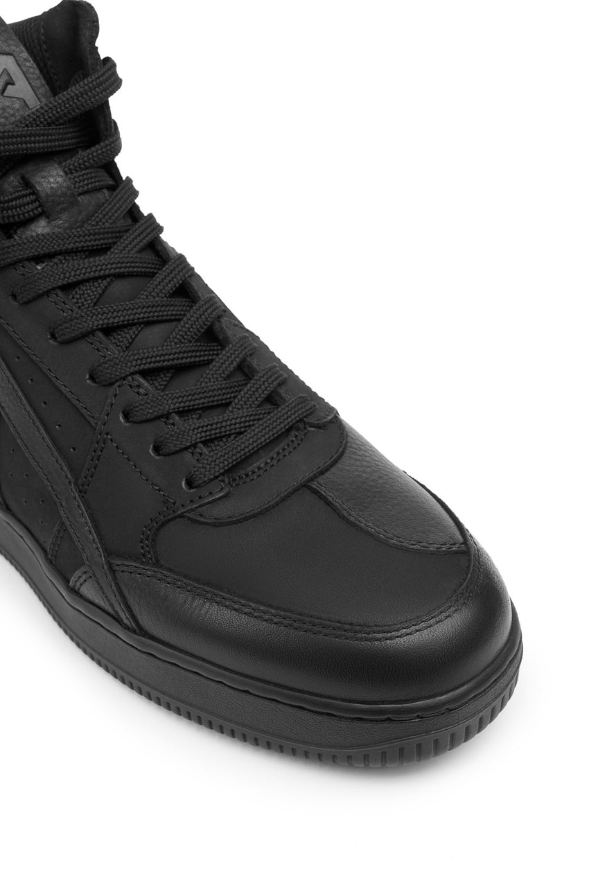 Pando Moto branded Apec black high-top sneaker closeup view of the toe on a white background