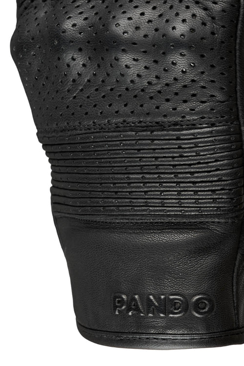 Close-up of an Onyx black leather motorcycle glove with 'Pando' branding on a white background