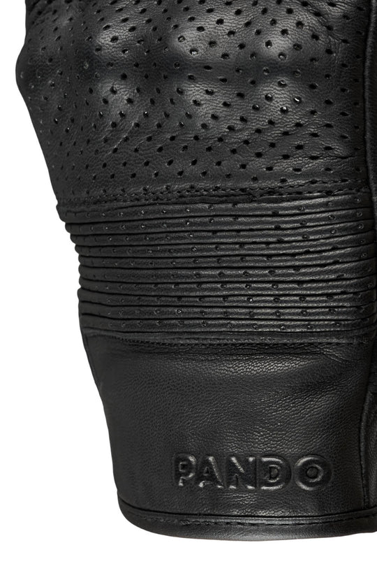 Close-up of an Onyx black leather motorcycle glove with 'Pando' branding on a white background
