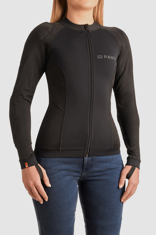 Person wearing a black Pando Moto armoured base layer for motorcycle riding on a light gray background