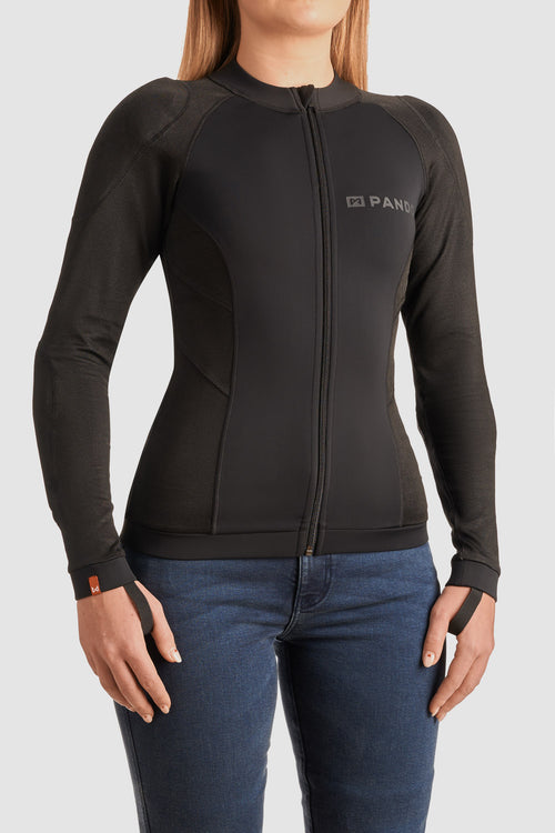 Person wearing a black Pando Moto armoured base layer for motorcycle riding on a light gray background