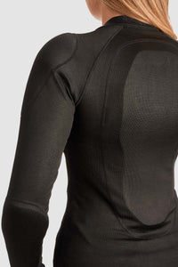 Black long-sleeve Pando Moto armoured base layer for motorcycle riding worn by a person on a light gray background
