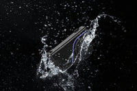 Product being submerged in water with a black background
