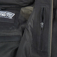 Close-up of a black jacket with a zipper and a brand label on a dark background