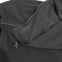 Close-up of a black jacket with a zipper and mesh material.