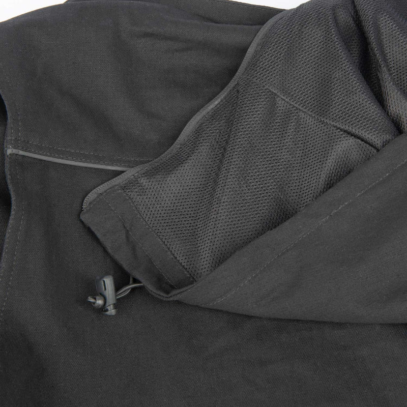 Close-up of a black jacket with a zipper and mesh material.