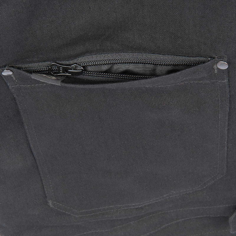Close-up of a dark gray fabric pocket with a zipper on a matching background