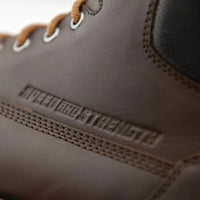 Close-up of the Speed and Strength CALL TO ARMS Motorcycle Boot showcasing the premium brown leather upper with embossed Speed and Strength branding and durable stitched construction. Designed to deliver long-lasting durability, classic motorcycle styling, and dependable comfort for everyday riding.
