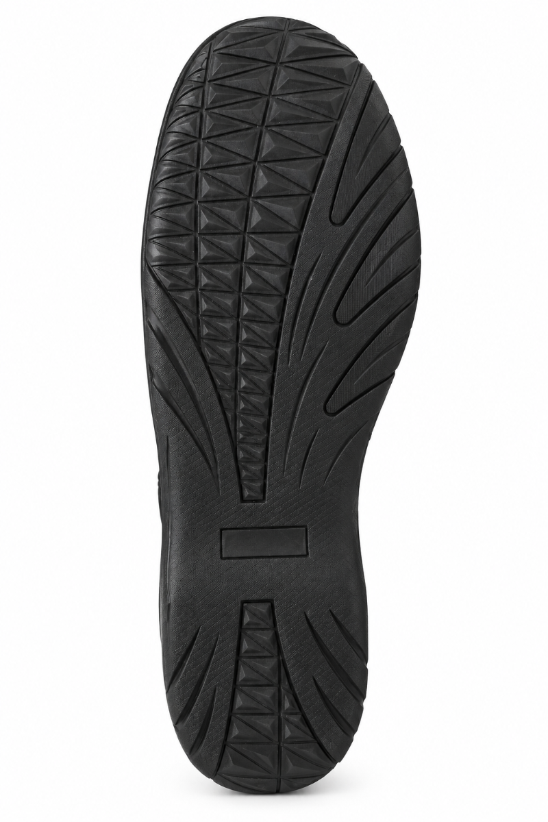 A close-up view of a black rubber shoe sole with detailed tread patterns, shown against a plain white background.
