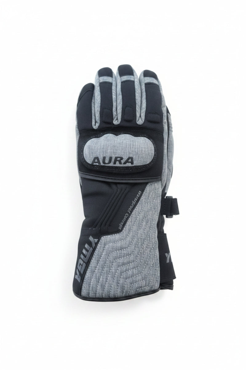 Gray and black glove with 'Aura' branding on a wooden surface