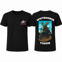 Front and back of a black YMGA Whitehorse Yukon T-shirt featuring a moose in sunglasses riding an adventure motorcycle through the mountains.