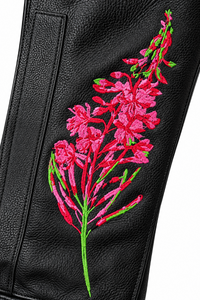 Close-up of exclusive pink and red Fireweed embroidery with green detailing on YMGA black leather women’s motorcycle chaps.