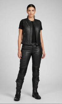 YMGA custom made women's black leather motorcycle vest with zippered pockets on a white background