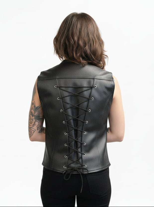Back view of a black women’s leather motorcycle vest with adjustable lace-up detailing down the spine, worn over a black outfit.