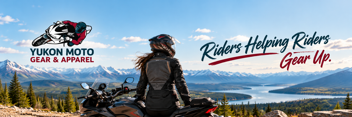 Motorcycle rider wearing a black LEATT riding jacket and helmet, sitting on a motorcycle overlooking a scenic Yukon mountain valley and lake. Yukon Moto Gear & Apparel website banner featuring the slogan “Riders Helping Riders Gear Up!”