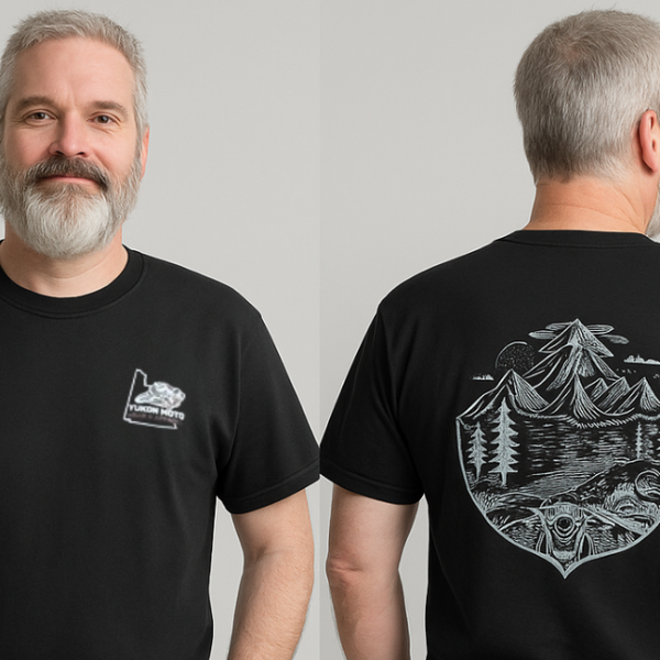 Man wearing a black t-shirt with a mountain graphic on the front and back, against a plain background.